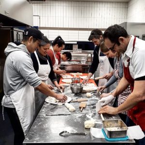 Cooking students making Gnocchi at cooking classes in Vancouver